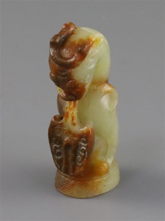 A Chinese pale celadon and russet jade finial, Song dynasty or later, H.5.4cm